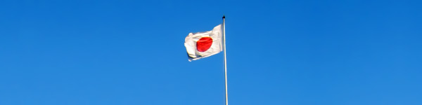 Japan's flag - Is it safe to travel to Japan?