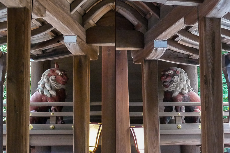 Inside the honden, flanked by komainu statues