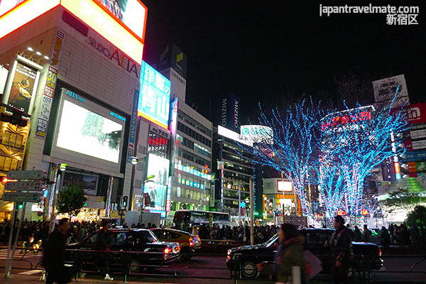 Shopping area next to Shinjuku Station, Tokyo at night.