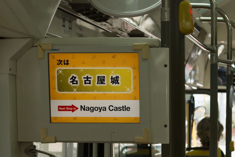 Inside the Nagoya Castle bus: sign in English