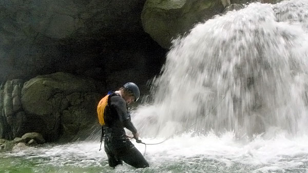 Hooking myself up to the line, to climb the waterfall