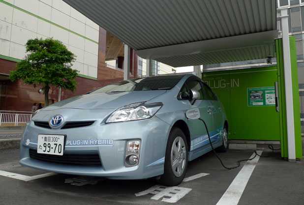 Toyota Prius Plug-In Hybrid (front view) inside charging station.