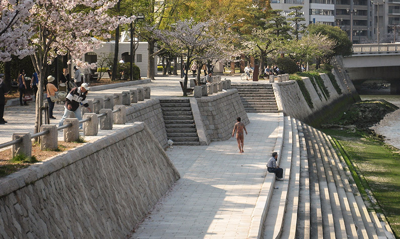 Naked Yakusa man at the Motoyasu River in Hiroshima
